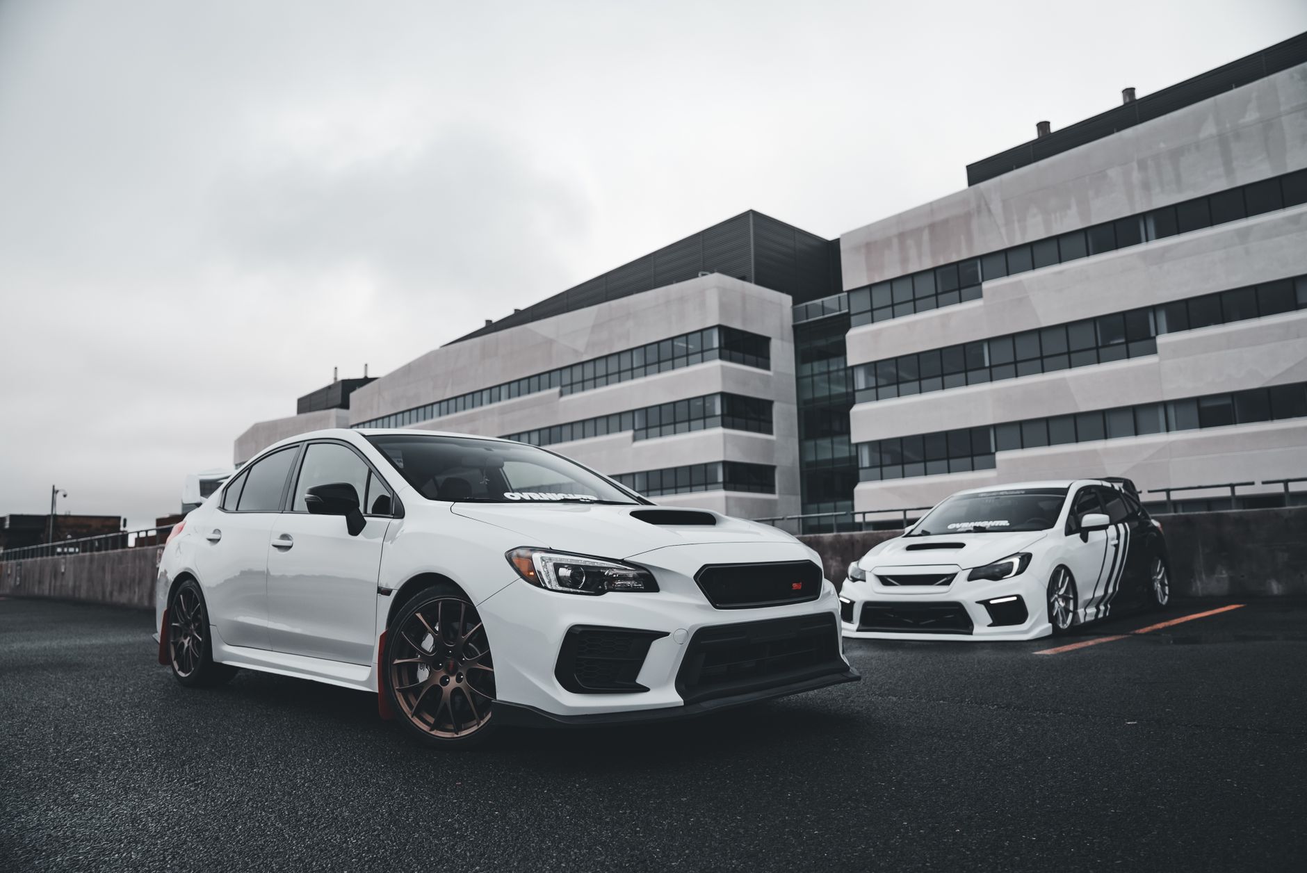 White sports cars showcased in a modern urban background, perfect for automotive enthusiasts. — Free Service For Car Removal