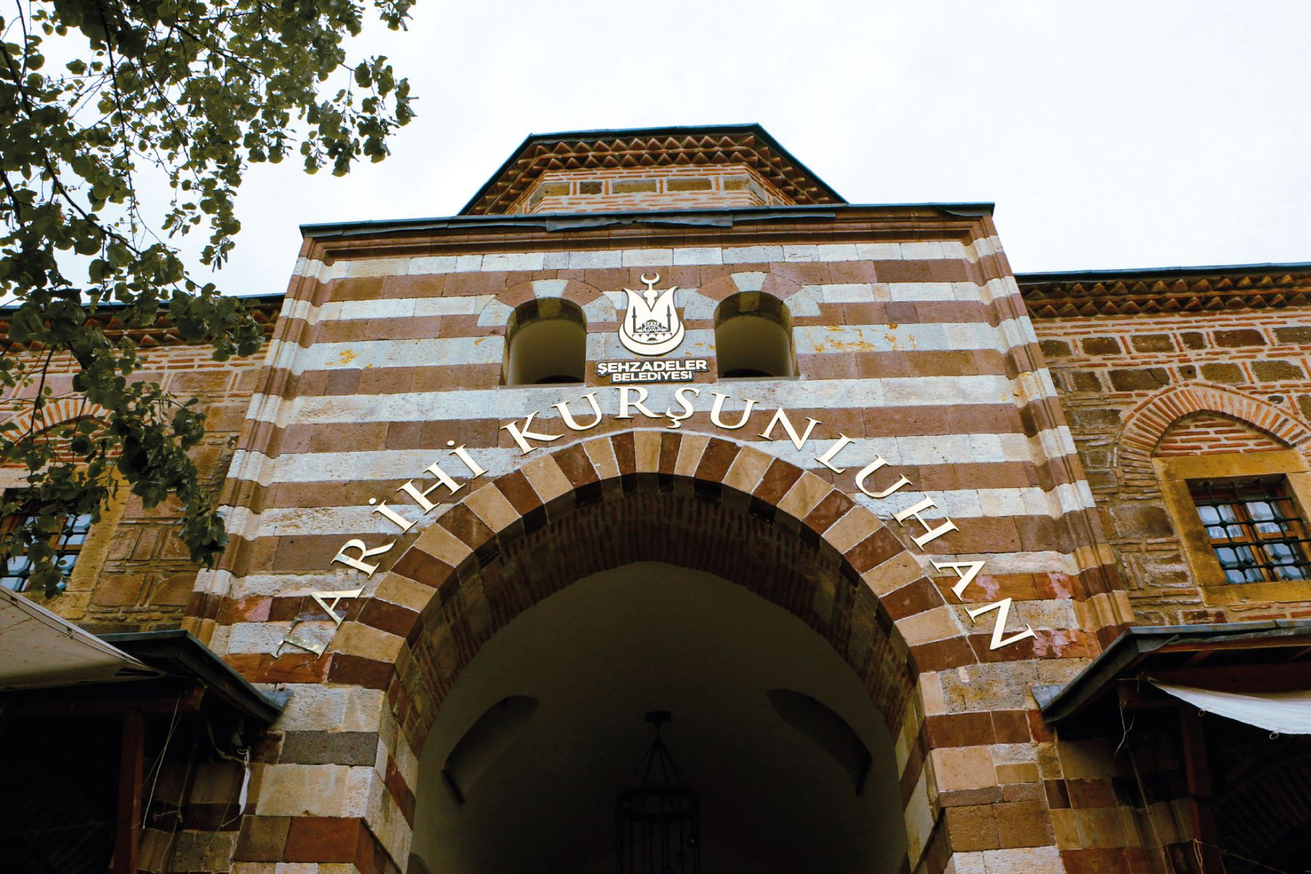 Entrance of the historic Kurşunlu Han in Manisa, Türkiye featuring traditional Ottoman architecture. — How To Stay Safe When
