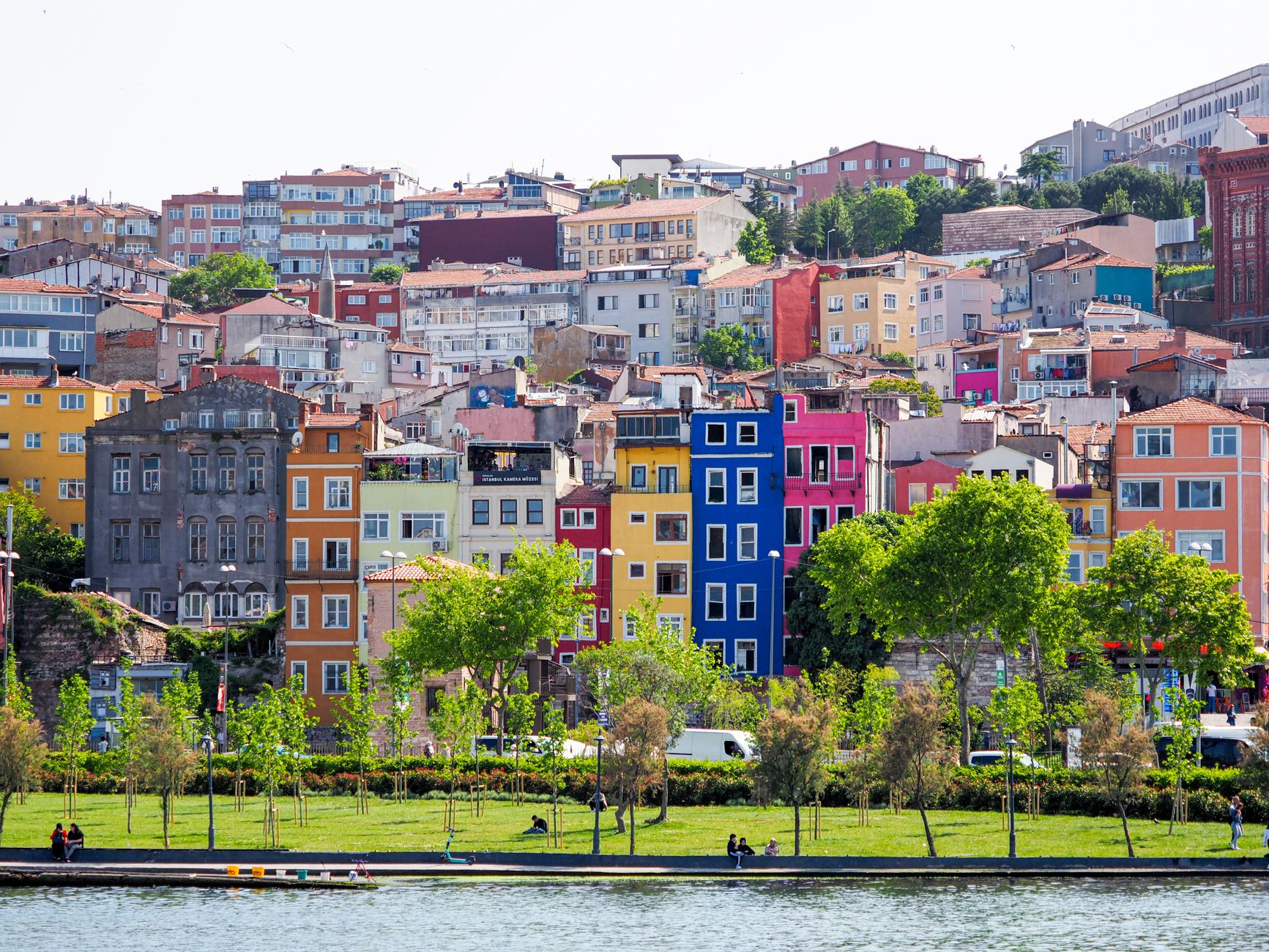 Vibrant multi-colored facades in a residential district of Istanbul, Turkey, with green park and trees. — How to Use Free Bet