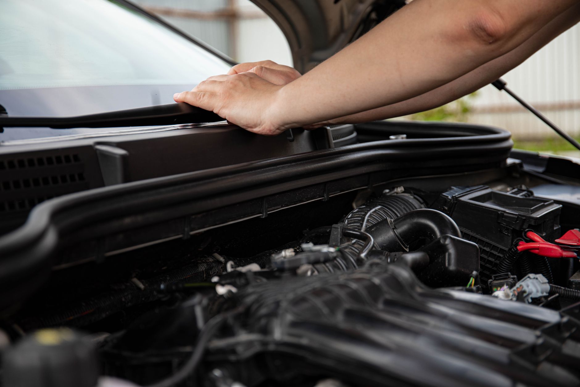 Close-up of hands working on car engine. Detailed view of automotive repair. — Maintenance (Alimony) in Wisconsin