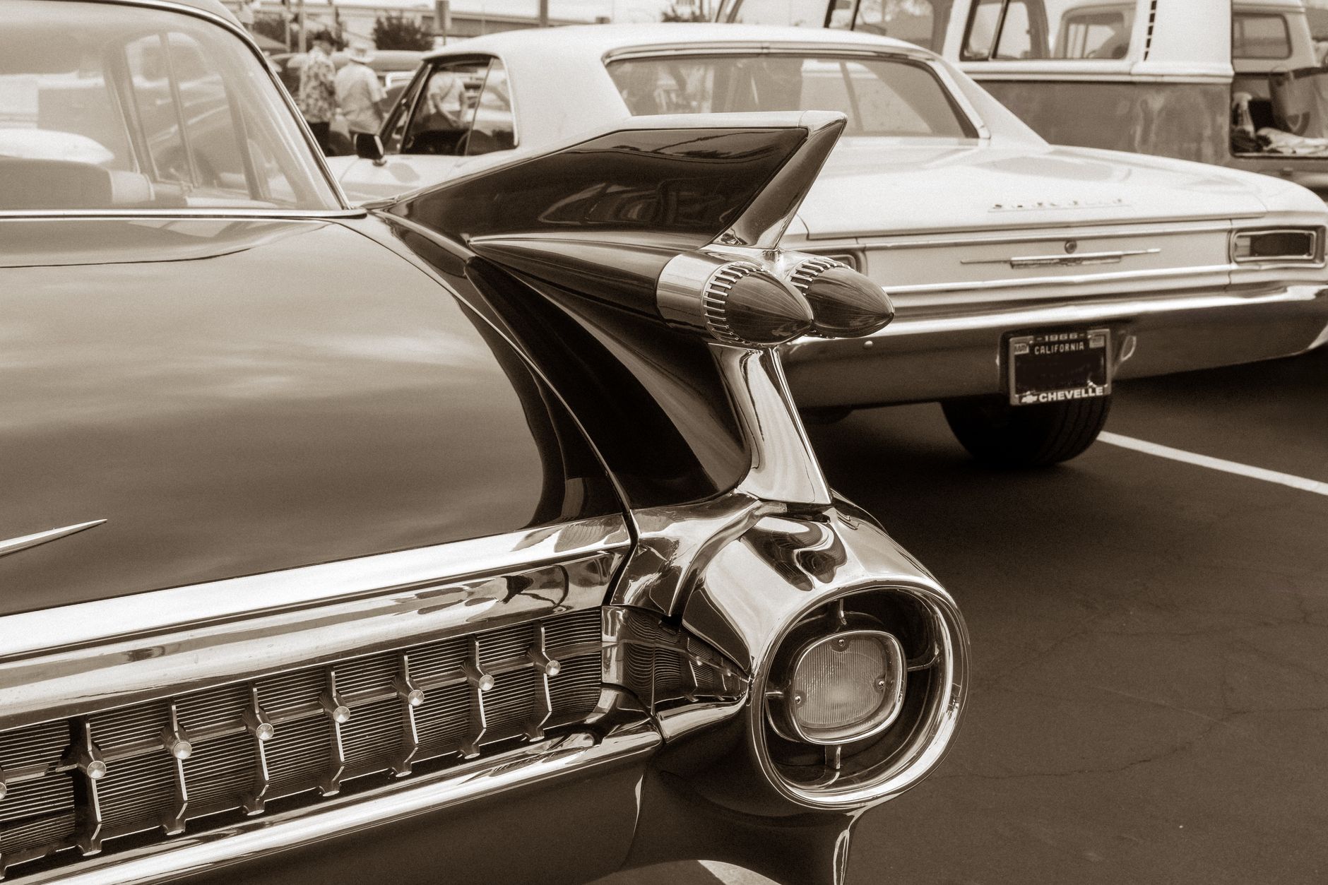 Sepia-toned image of classic American cars at an outdoor car show. — Why You Should Go For Wedding Limo Toronto